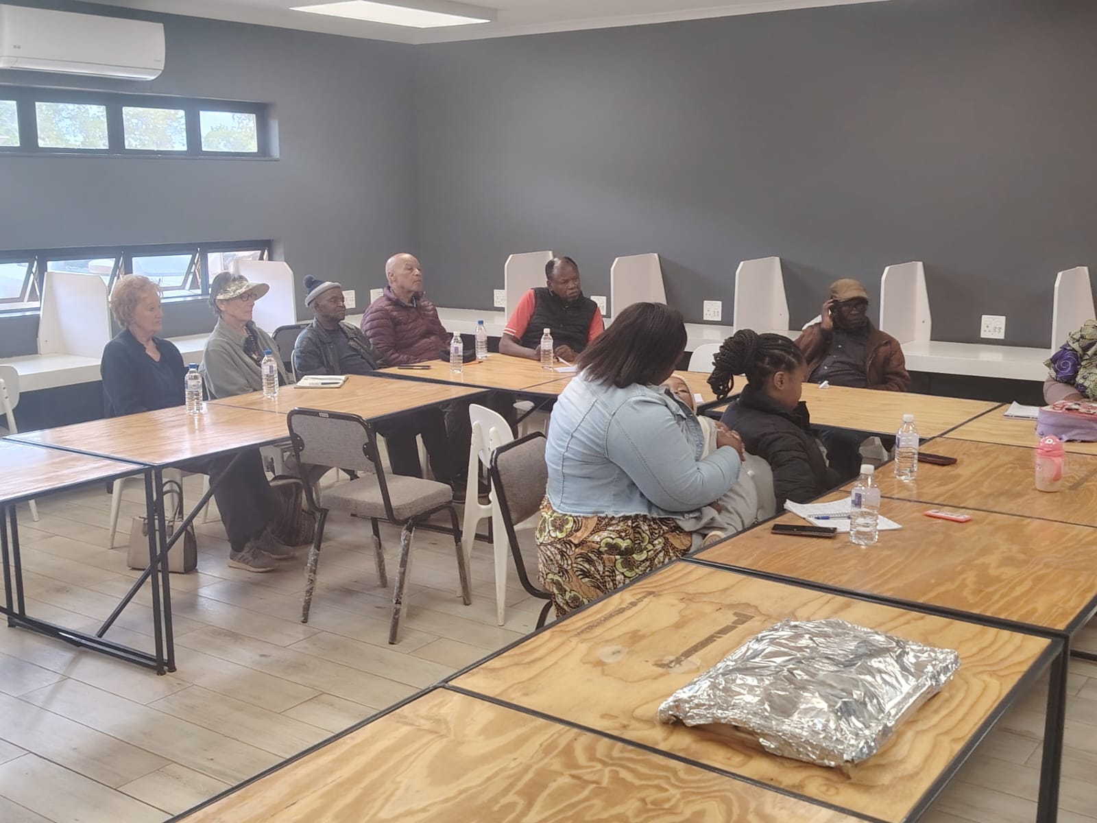 Participants gathered around a table for a planning conversation