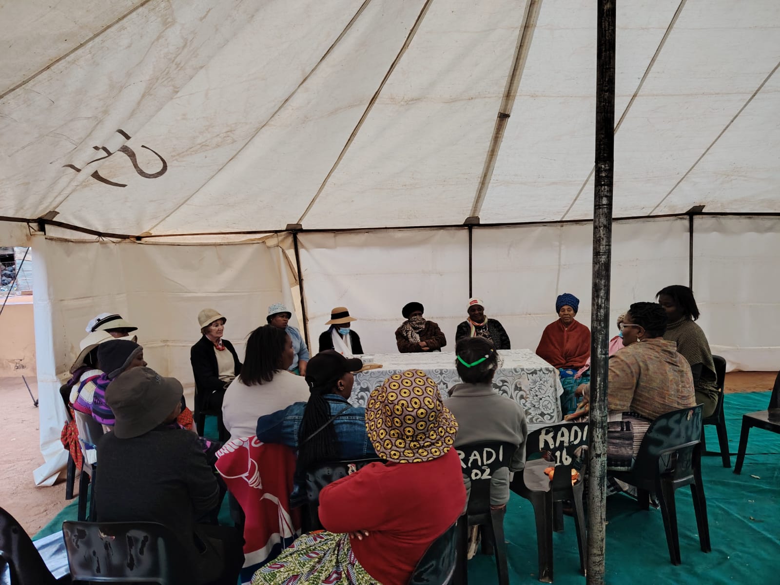 Community members gathered beneath a marquee at an Africa Celebrating event